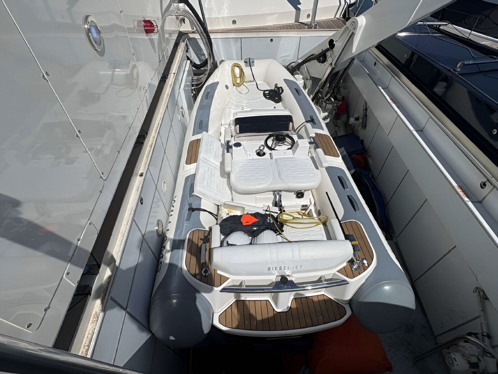 A rescue boat seen from above in its stowage bay